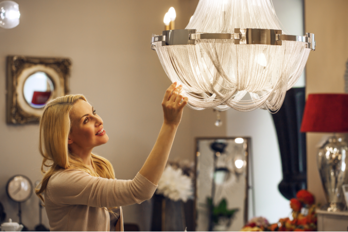 lady looking at chandelier